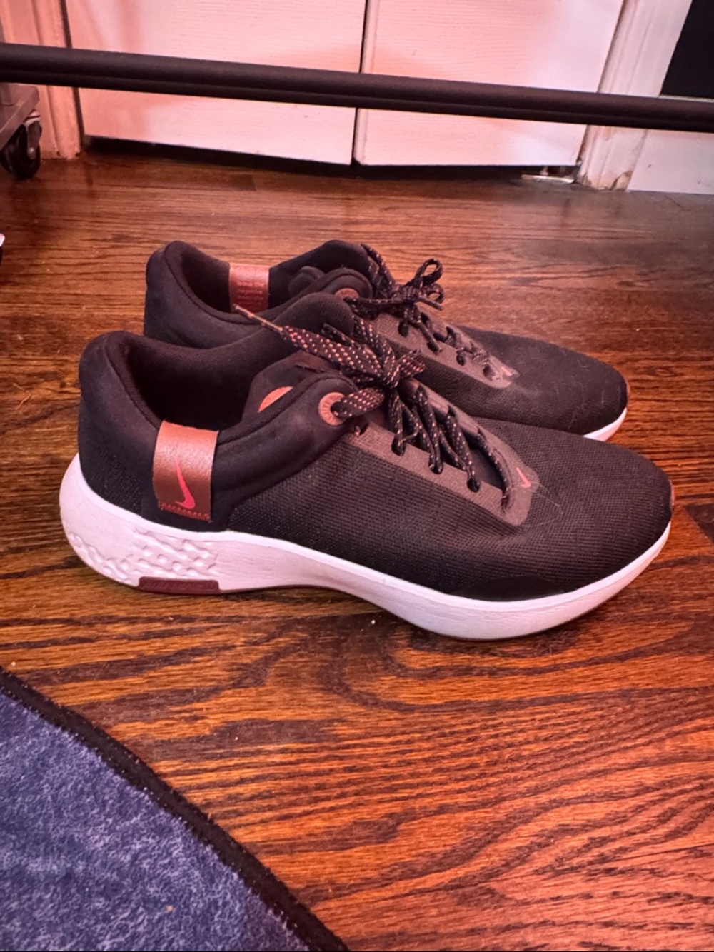 Nike Renew women’s Black and Copper Lightweight Trainer